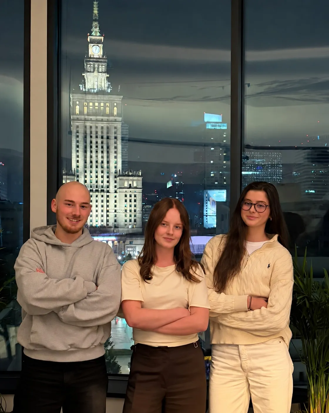 The winning team, “Ekipa”, at Quesma’s token economics hackathon. AI was used to remove the lamp and subtly adjust the middle participant’s facial expression.