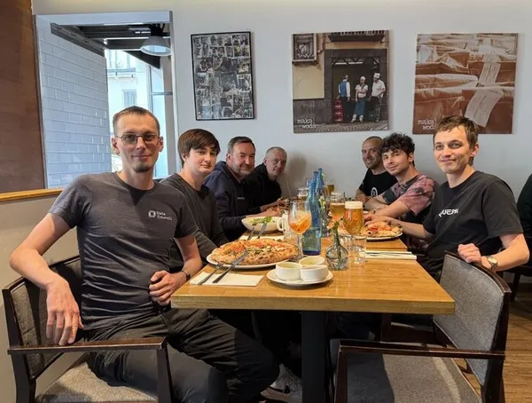 Quesma team eating pizzas